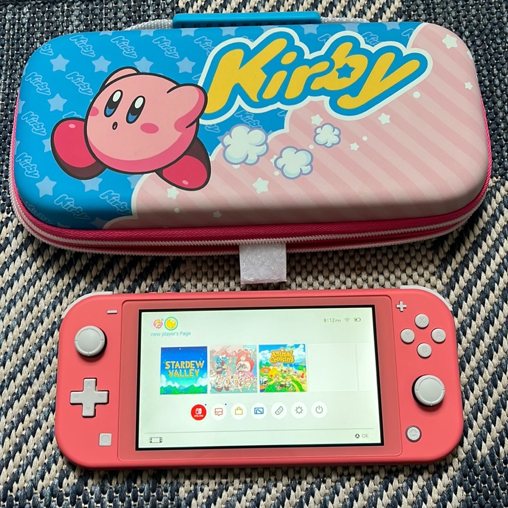 Nintendo Switch Lite W/ Kirby case + Animal Crossing, Stardew Valley, Calico.